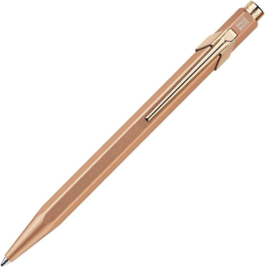 Rose gold pen on a white background