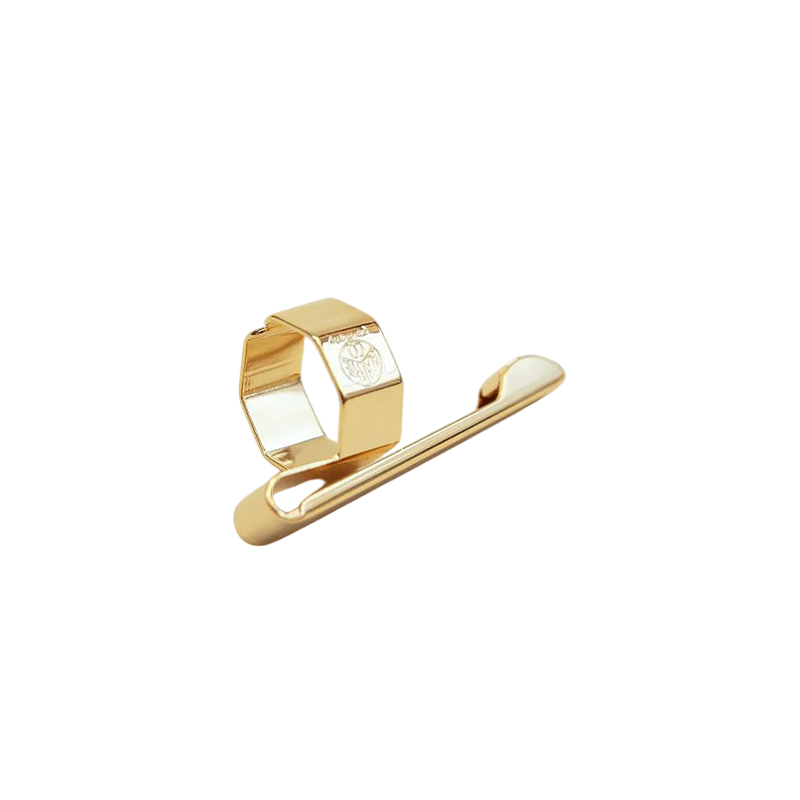 Gold hair clip on a white background
